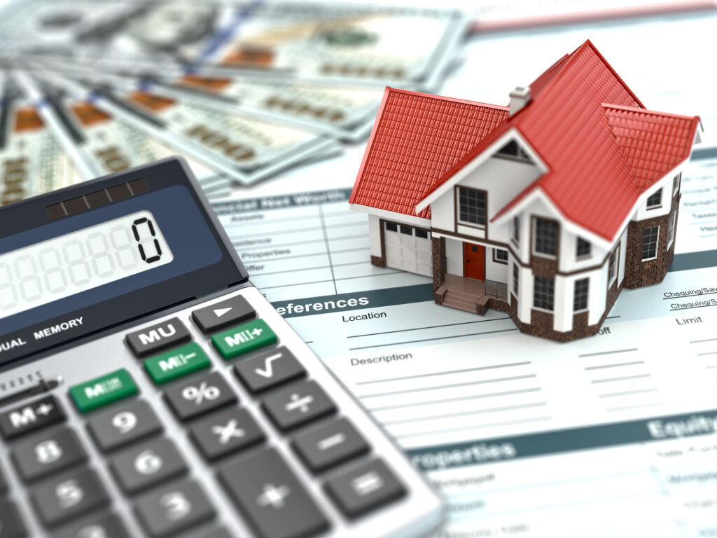 This is an image of a home and calculator to represent home mortgage prices.